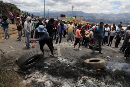 Trucks block main roads during protests after Ecuador's President Lenin Moreno's government ended four-decade-old fuel subsidies, in Calderon, near Quito