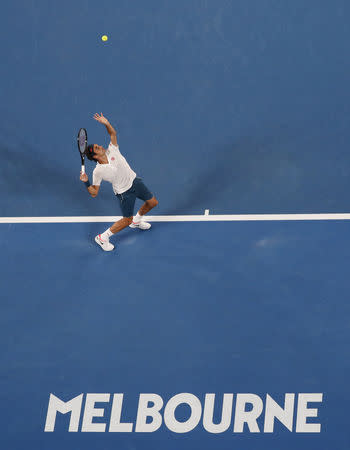 Tennis - Australian Open - Third Round - Melbourne Park, Melbourne, Australia, January 18, 2019. Switzerland's Roger Federer in action during the match against Taylor Fritz of the U.S. REUTERS/Aly Song