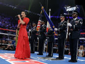 Kirby Asunto sings the Philippine national anthem before the WBO welterweight title fight between Manny Pacquiao, from the Philippines, and Timothy Bradley, from Palm Springs, Calif., Saturday, June 9, 2012, in Las Vegas.