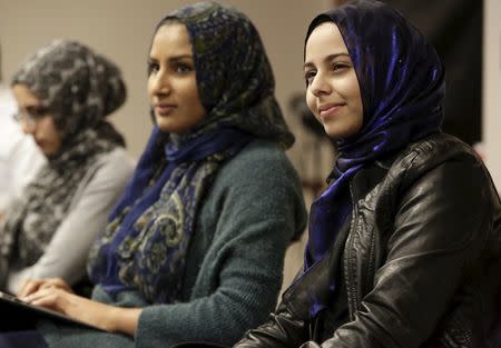 University of California Irvine students Bushra Bangee (R), 19, and Huda Herwees, 19, watch the Republican presidential debate at the Council on American-Islamic Relations (CAIR) office in Anaheim, California December 15, 2015. REUTERS/Jason Redmond