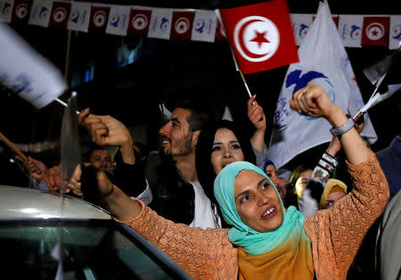 Supporters of the Islamist Ennahda party celebrate outside the party's headquarters after claiming victory in a local poll in Tunis, Tunisia, May 6, 2018. REUTERS/Zoubeir Souissi