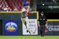 Chicago Cubs' Christopher Morel fields the ball and throws out Cincinnati Reds' Nick Senzel at first base during the seventh inning of a baseball game in Cincinnati, Tuesday, May 24, 2022. The Cubs won 11-4. (AP Photo/Aaron Doster)