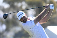 Dustin Johnson hits his tee shot on the eighth hole of the North Course during the second round of the Farmers Insurance Open golf tournament, Thursday Jan. 27, 2022, in San Diego. (AP Photo/Denis Poroy)