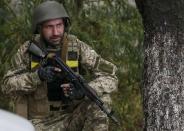 A Ukrainian serviceman takes his position a in Debaltseve, September 9, 2014. REUTERS/Gleb Garanich