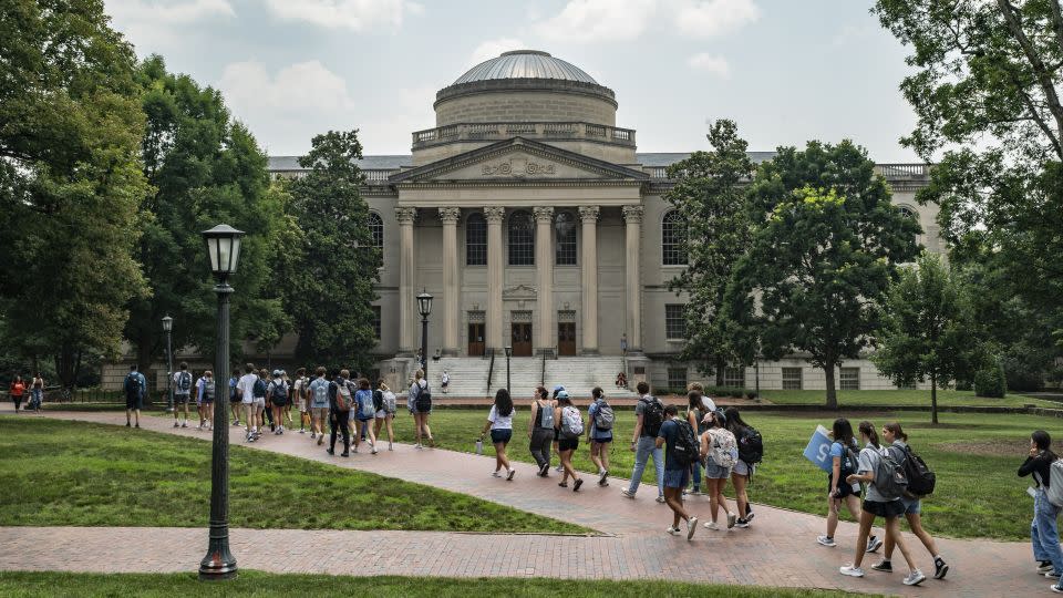 People walk on the campus of the University of North Carolina Chapel Hill on June 29, 2023. The Biden administration canceled $168 billion in student loan debt for 4.8 million Americans. - Eros Hoagland/Getty Images