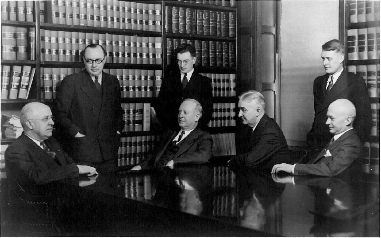 The members of the Black, McCuskey, Souers & Arbaugh law firm are pictured in the company's original offices in Harter Bank building in Canton. Seated, from left to right, are Loren Souers, Emery McCuskey, Walter Ruff and Homer Black, while standing are Russell Mack, Donald Merwin and Albert Arbaugh.