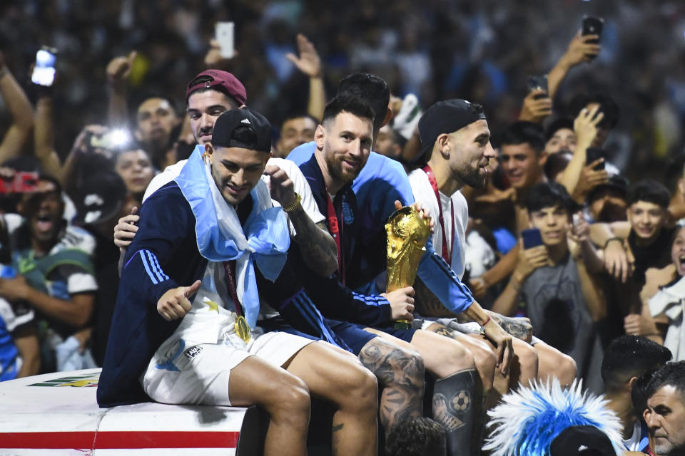 BUENOS AIRES, ARGENTINA - DECEMBER 20: Lionel Messi of Argentina smiles to the fans during the caravan of the Argentina men's national football team after winning the FIFA World Cup Qatar 2022 on December 20, 2022 in Buenos Aires, Argentina. (Photo by Rodrigo Valle/Getty Images)