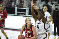 North Carolina State center Elissa Cunane (33) looks for a shot against South Carolina forward Aliyah Boston (4) during the first half of an NCAA college basketball game Thursday, Dec. 3, 2020, in Columbia, S.C. (AP Photo/Sean Rayford)