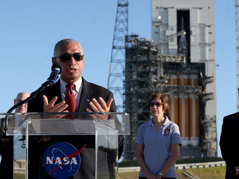 Charles F. Bolden, Jr., NASA Adminstrator, speaks to the media near the United Launch Alliance Delta 4 rocket.