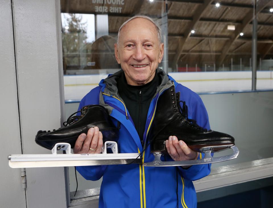 Richard Veron holds his speed skating skate next to his ice dancing skate while at the ice rink at the Harvey School in Katonah Dec. 1, 2023. Veron, who is 88 years old and from White Plains, is a speed skater and ice dancer.
