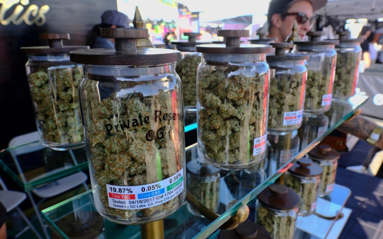 Jars of marijuana are on display for sale - AP