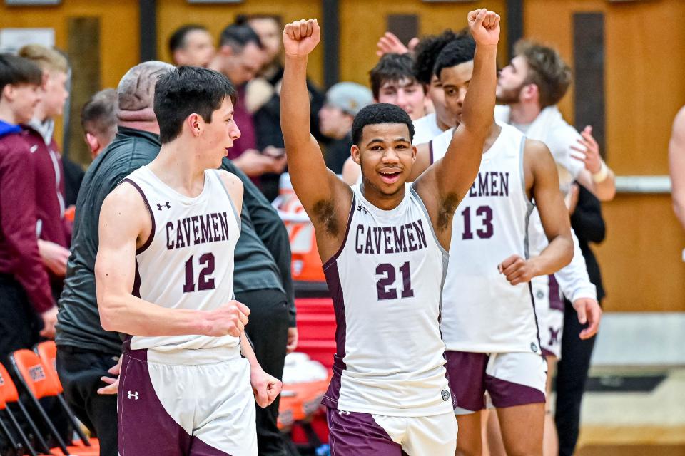 Mishawaka's Arthur Jones (21) celebrates as time expires in the sectional game against Riley. Mishawaka won 71-58 Saturday, March 4, 2023, at LaPorte High School.