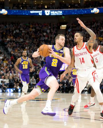 Dec 6, 2018; Salt Lake City, UT, USA; Utah Jazz forward Joe Ingles (2) drives to the basket against Houston Rockets guard Gerald Green (14) during the first half at Vivint Smart Home Arena. Russ Isabella-USA TODAY Sports