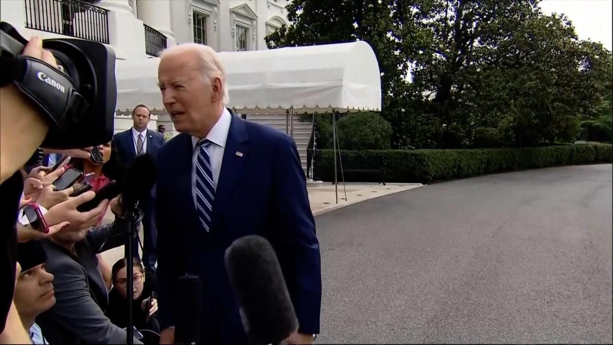 President Joe Biden speaks to reporters while leaving the White House for Chicago