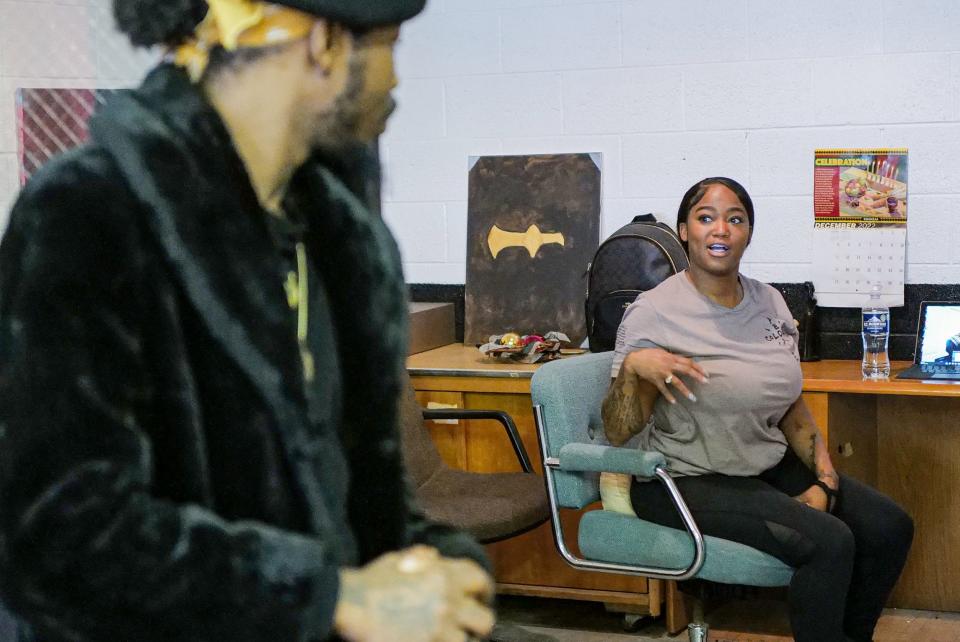 James Henson listens as Ahsahki Guy, second in command of the Young Black Panther Party, talks about plans for the future now that they have a space to operate out of, Friday, Dec. 2, 2022.