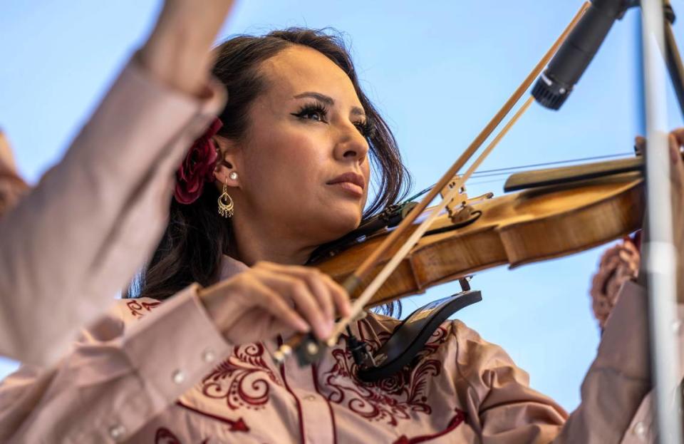 Sayra Fernandez, violin player and singer with Mariachi Bonitas de Dinorah Klingler, performs at the Taco Festival in Colusa on Aug. 6.