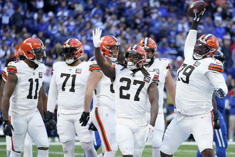 Cleveland Browns running back Kareem Hunt (27) celebrates with teammates after a 2-yard touchdown run during the first half of an NFL football game against the Indianapolis Colts, Sunday, Oct. 22, 2023, in Indianapolis. (AP Photo/Michael Conroy)