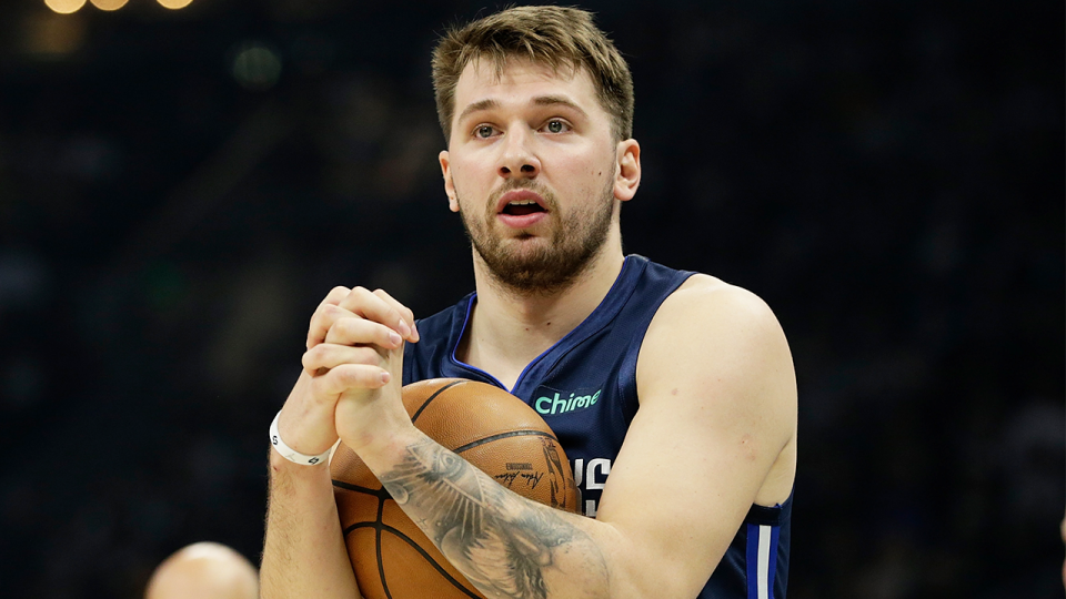 Luka Dončić (pictured) holding the ball during an NBA game.