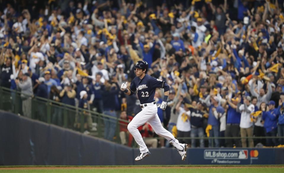 Milwaukee Brewers' Christian Yelich (22) rounds the bases after hitting a two-run home run during the third inning of Game 1 of the National League Divisional Series baseball game against the Colorado Rockies Thursday, Oct. 4, 2018, in Milwaukee. (AP Photo/Jeff Roberson)