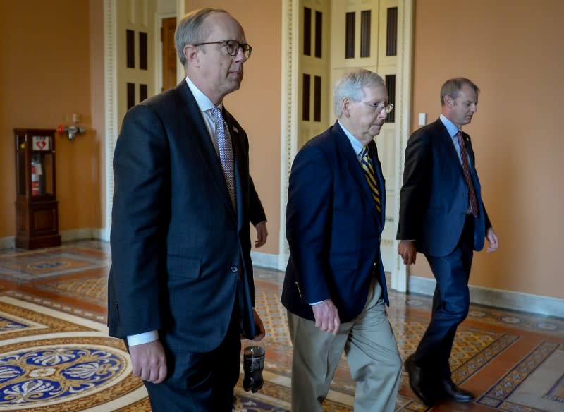 Ueland and McConnell leave the Senate floor after a meeting to wrap up work on coronavirus economic aid legislation