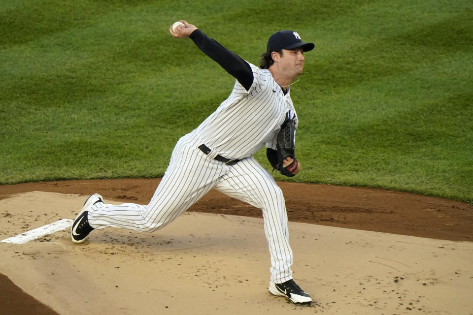 FILE - New York Yankees starting pitcher Gerrit Cole winds up during the first inning of a baseball game against the Baltimore Orioles in New York, in this Tuesday, April 6, 2021, file photo. Yankees pitcher Gerrit Cole is the third highest-paid player in 2021 at $36 million. (AP Photo/Kathy Willens, File)