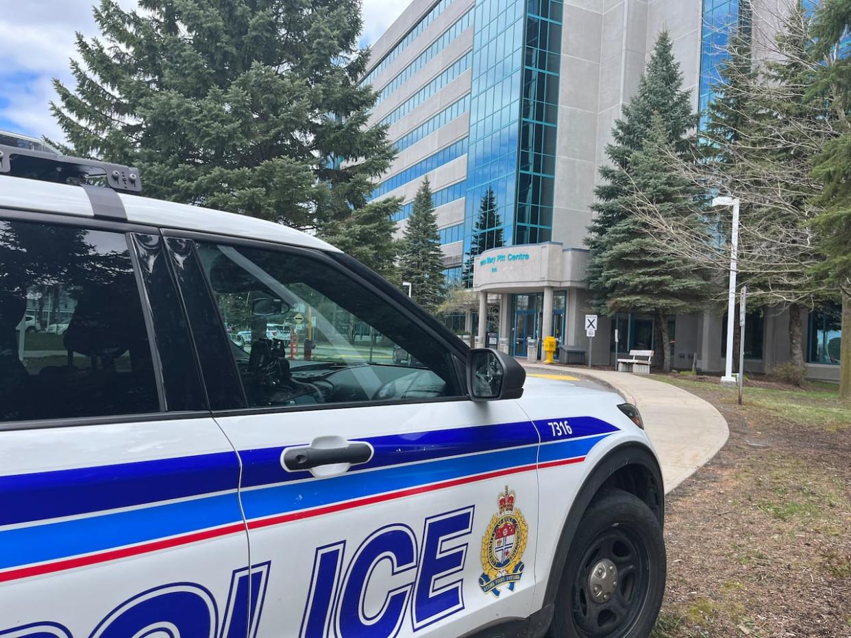 An Ottawa police vehicle sits near the Mary Pitt Centre at 100 Constellation Dr. on Thursday after a teen was rushed to hospital following a stabbing. (Safiyah Marhnouj/CBC - image credit)