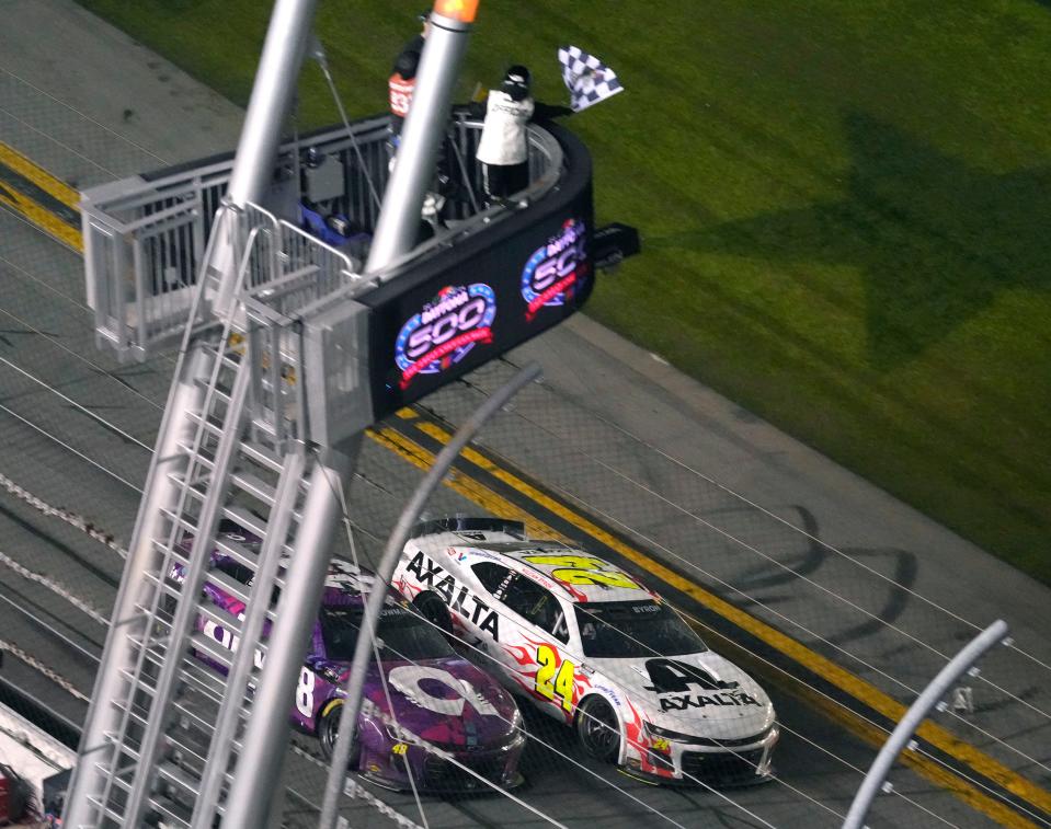 William Byron takes the checkered flag to win the Daytona 500 at Daytona International Speedway, Monday, Feb. 19, 2024.