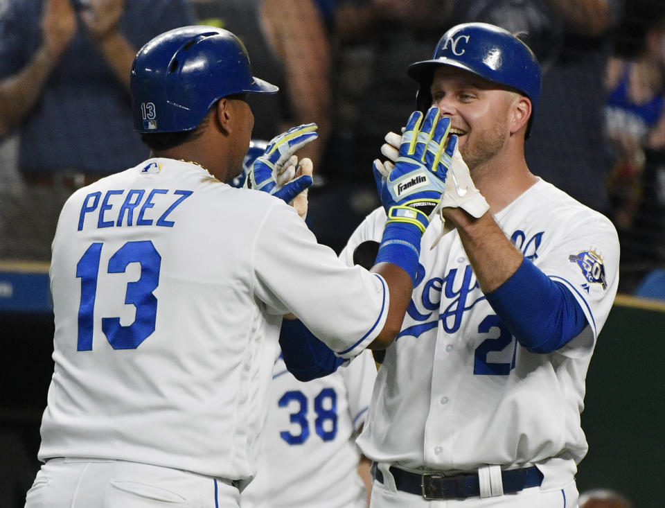 Kansas City Royals' Salvador Perez (13) celebrates his home run with Lucas Duda (21) during the fifth inning of the team's baseball game against the Detroit Tigers on Tuesday, July 24, 2018, in Kansas City, Mo. (AP Photo/Ed Zurga)