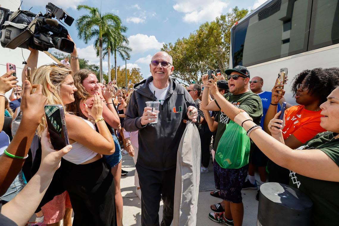 Miami Hurricanes men’s basketball head coach Jim Larrañaga is greeted by fans outside the University of Miami’s Watsco Center as the team prepares to depart on Wednesday, March 29, 2023, for the NCAA Final Four games in Houston.