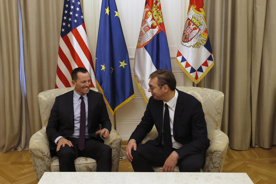 U.S President Donald Trump's envoy for the Kosovo-Serbia dialogue, Ambassador Richard Grenell, left, speaks with Serbian President Aleksandar Vucic during a meeting in Belgrade, Serbia, Thursday, Oct. 10, 2019. Grenell is meeting officials in Belgrade as part of a renewed effort to restart negotiations and resolve decades-long disputes between former war foes. (AP Photo/Darko Vojinovic)