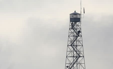 Law enforcement inspects the observation tower at the headquarters to the Malheur National Wildlife Refuge outside Burns, Oregon February 12, 2016. REUTERS/Jim Urquhart