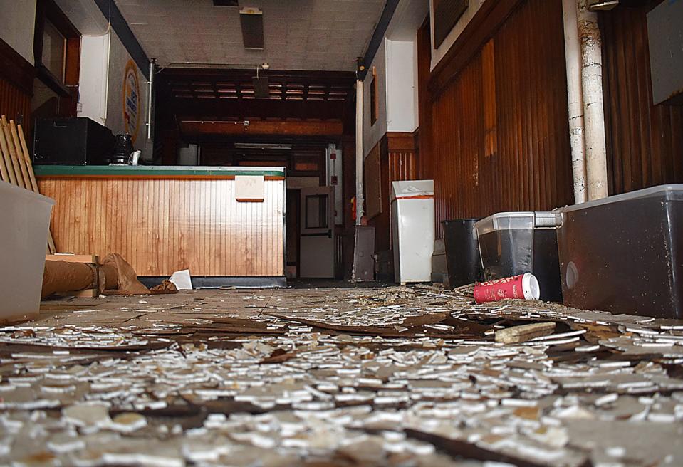 Debris litters the floor inside the lobby of the Bank Street Armory, on Bank Street in Fall River, seen Wednesday during a tour of the city-owned property.