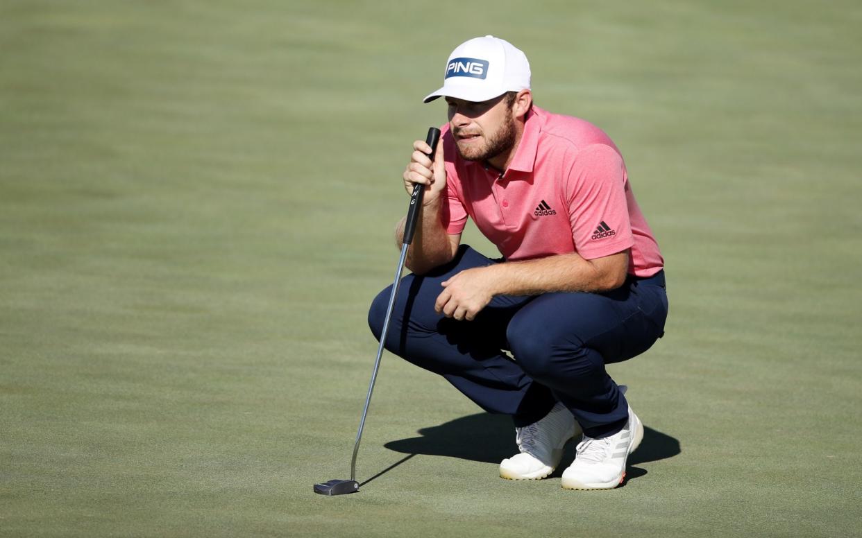 Tyrrell Hatton of England lines up a putt on the 12th green during the final round of The CJ Cup  - Getty Images