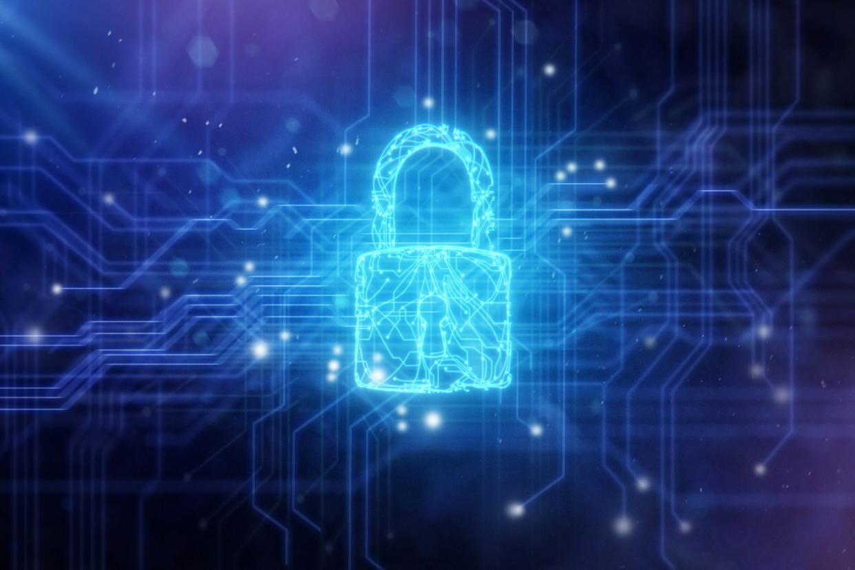  Padlock against circuit board/cybersecurity background. 