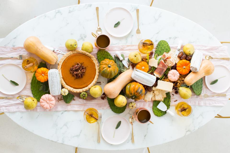 <p>Cooking (and then eating) might be No. 1 on your <a rel="nofollow noopener" href="https://www.housebeautiful.com/thanksgiving/" target="_blank" data-ylk="slk:Thanksgiving;elm:context_link;itc:0;sec:content-canvas" class="link ">Thanksgiving</a> to do list, but you may want to take a little time to consider decorating your table. You could <a rel="nofollow noopener" href="https://www.housebeautiful.com/entertaining/holidays-celebrations/g2627/pumpkin-decorating-ideas/" target="_blank" data-ylk="slk:throw some mini pumpkins on there;elm:context_link;itc:0;sec:content-canvas" class="link ">throw some mini pumpkins on there</a> and call it a day, but these pretty displays will convince you to be a little bit more creative than that. Why have just a few mini pumpkins when you could have a runner of gourds?! Exactly.</p>