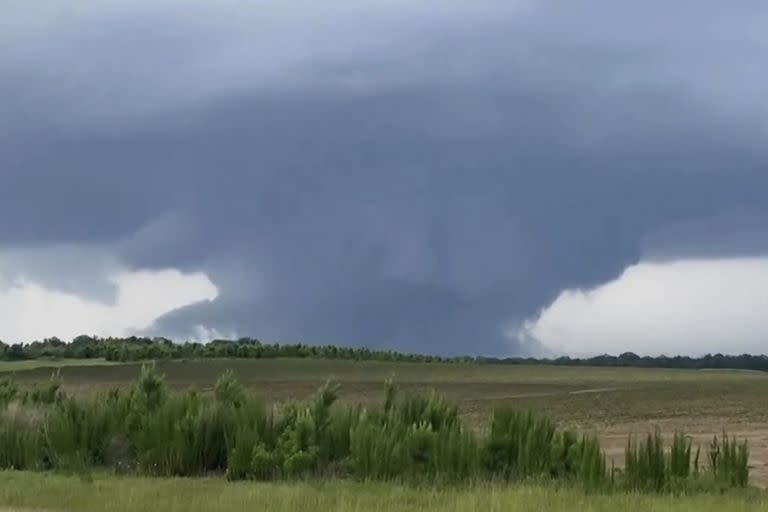 This screenshot taken from a video shows a tornado on June 14, 2023, in Blakely, Ga. Officials from Texas to Georgia are reporting damaging winds and possible tornadoes as a powerful storm system crosses the South. (Rand McDonald via AP)