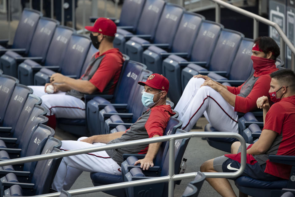 Washington Nationals players sitting in the stands.