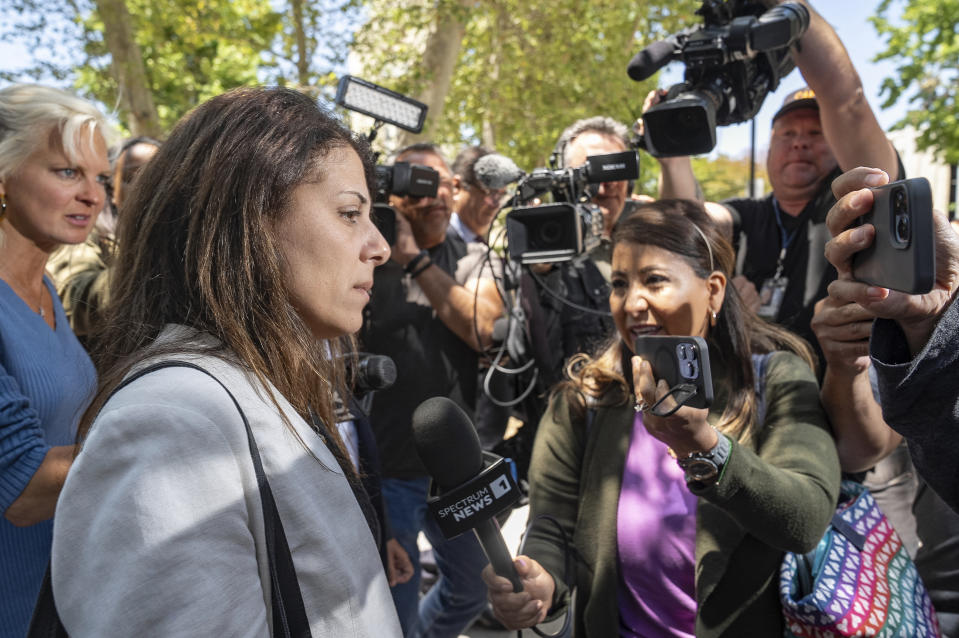 Nancy Iskander, left, pauses to talk to the media as she leaves Van Nuys Courthouse on Monday, June 10, 2024, in Van Nuys, Calif., after attending the sentencing hearing in the murder trial of Rebecca Grossman, who is charged in the deaths of her two sons, Mark, 11, and Jacob, 8. Grossman was sentenced Monday to 15 years to life in prison for the hit-and-run deaths of the two young brothers in a crosswalk. (AP Photo/Damian Dovarganes)