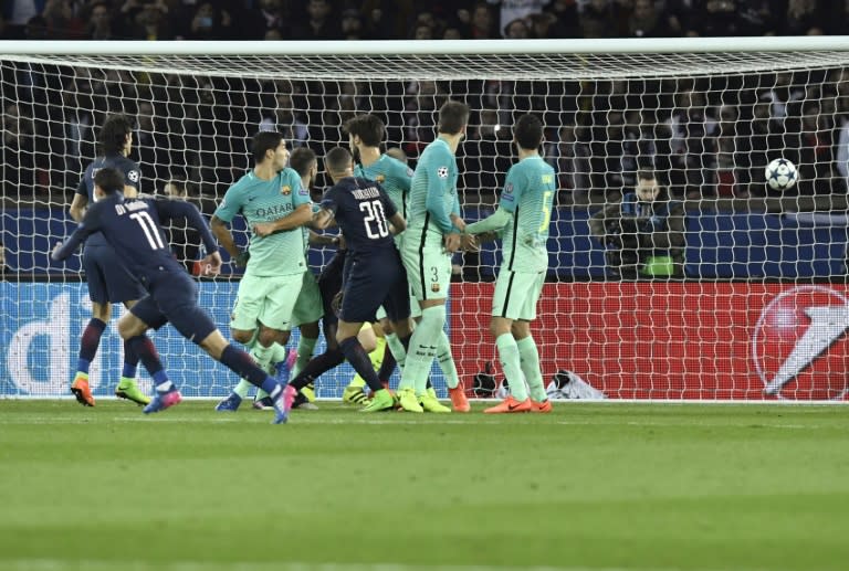 Paris Saint-Germain's Angel Di Maria (left) scores from a free kick during the Champions League match against Barcelona on February 14, 2017