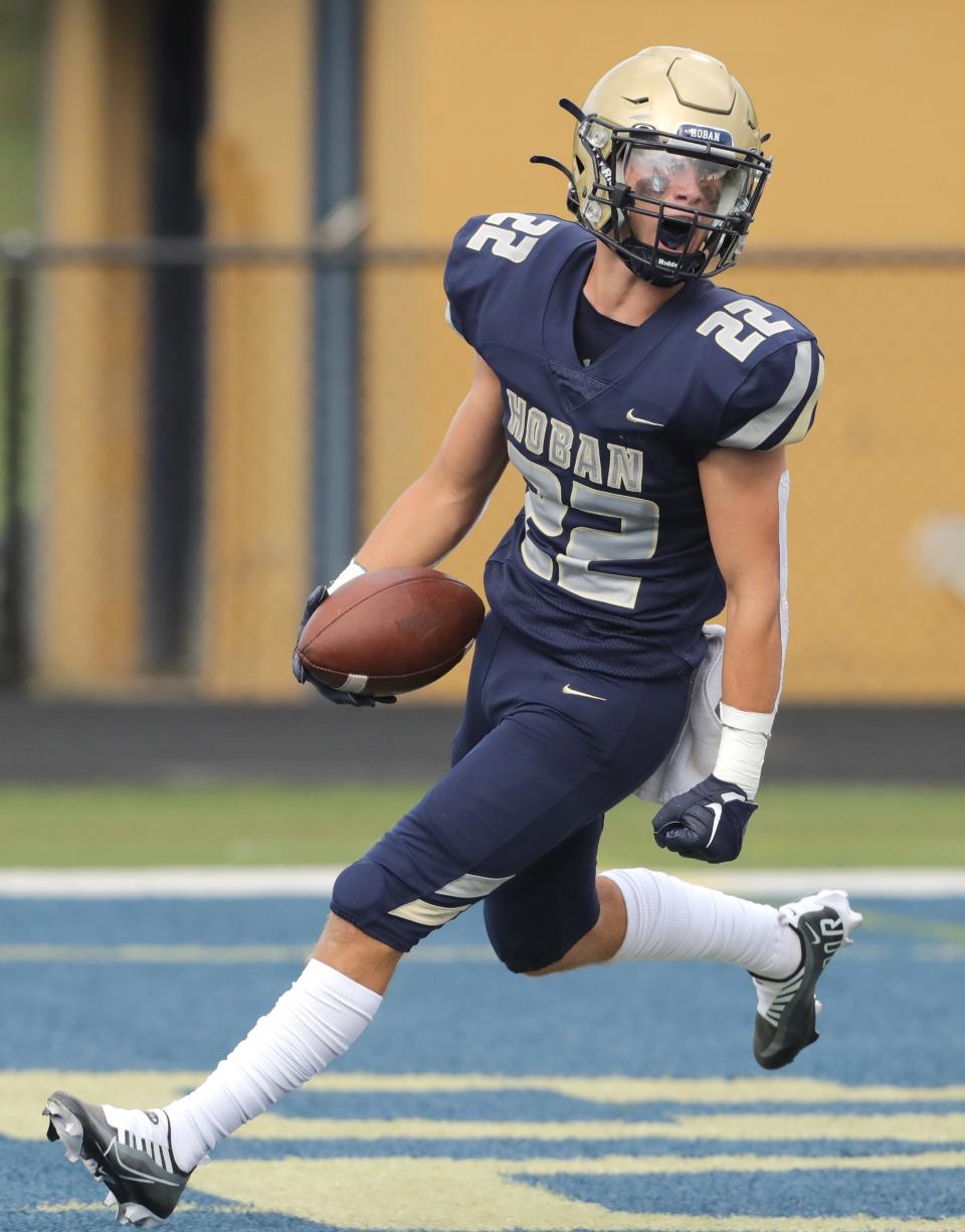 Hoban's Parker Falkenstein celebrates a first quarter touchdown against Erie Cathedral Prep on Friday, Aug. 26, 2022 in Akron, Ohio, at Dowed Field.