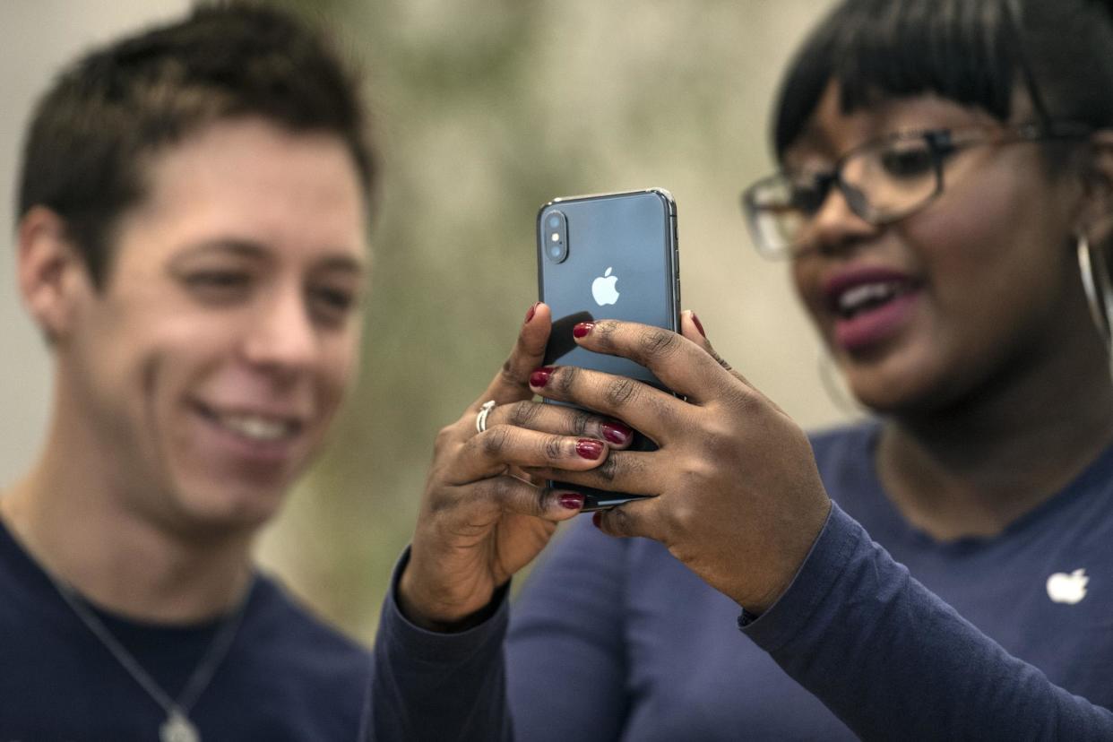 Staff members view the new iPhone X in the Apple store upon its release in the U.K, on November 3, 2017 in London, England: Carl Court/Getty Images