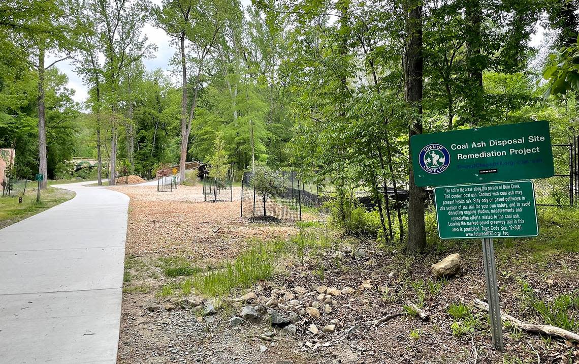 A sign posted along the Bolin Creek Greenway in Chapel Hill explains the town’s efforts to monitor and contain coal ash deposits located under the Chapel Hill Police Department site at 828 Martin Luther King Jr. Blvd.