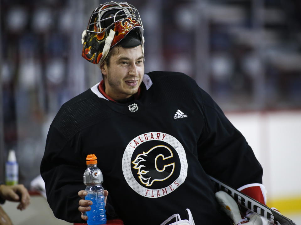 Calgary Flames goalie David Rittich, of the Czech Republic, takes break during NHL hockey training camp in Calgary, Friday, Sept. 13, 2019. (Jeff McIntosh/The Canadian Press via AP)