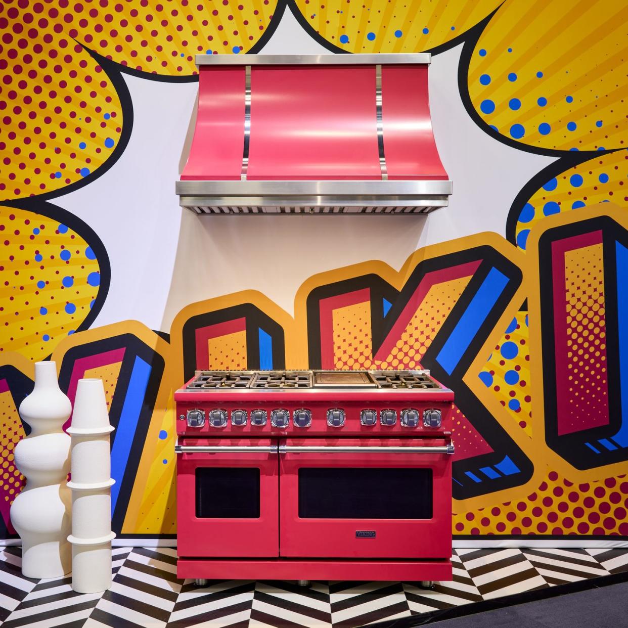 a pink oven range with a colorful background