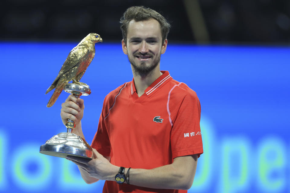 Daniel Medvedev of Russia holds the trophy after winning the Qatar Open tennis final in Doha, Qatar, Saturday, Feb. 25, 2023. (AP Photo/Hussein Sayed)