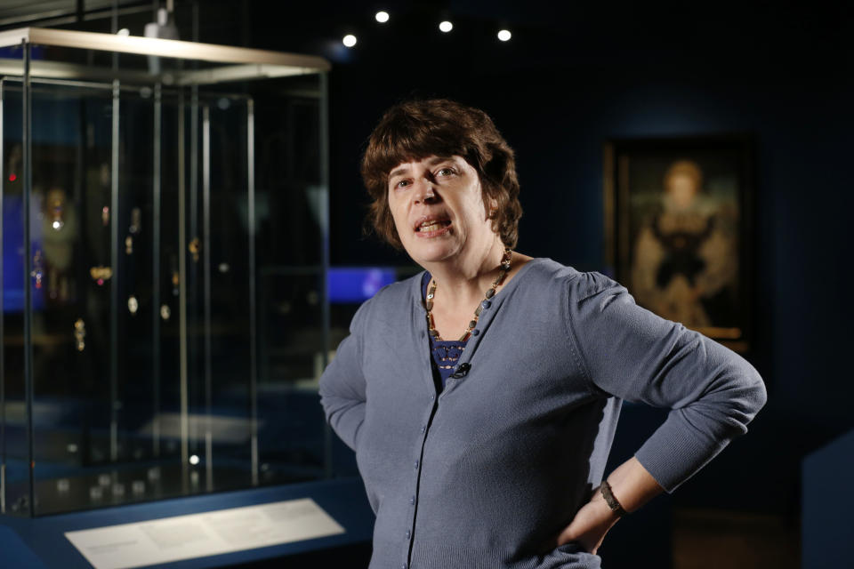 In this Monday, Oct. 7, 2013 photo, Hazel Forsyth, curator of the exhibition 'The Cheapside Hoard: London's Lost Jewels' speaks to Associated Press at the Museum of London in the City of London. Diamonds may be forever, but a lot of jewelry doesn’t survive through the centuries. Rings and bracelets get broken up for re-use, pearls decay, gold is melted down. That explains the excitement over a new London exhibition of the Cheapside Hoard _ a trove of almost 500 gemstones and pieces of jewelry from the 16th and 17th centuries, dug up by workmen demolishing a building in London more than 100 years ago. (AP Photo/Sang Tan)