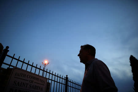 Father Michael Pfleger waits for the start of a weekly night-time peace march through the streets of a South Side neighborhood at Saint Sabina Church in Chicago, Illinois, September 16, 2016. REUTERS/Jim Young