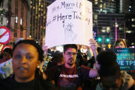 <p>Protesters walk through the streets of Miami as they protest the Trump administration’s immigration policies on January 17, 2018 in Miami, Fla. (Photo: Joe Raedle/Getty Images) </p>