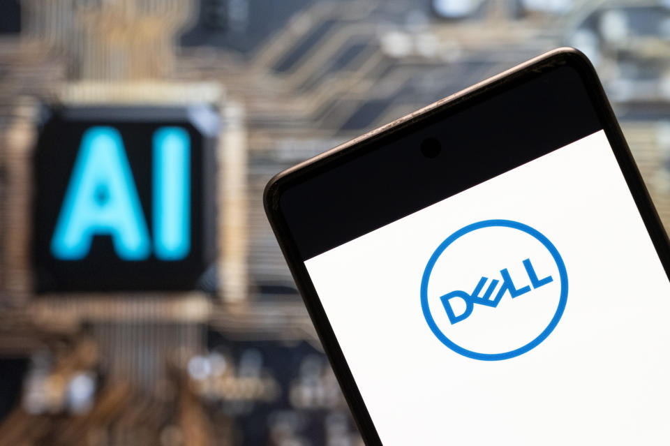 CHINA - 2023/11/10: In this photo illustration, the American multinational computer technology company, Dell (NYSE: DELL) logo seen displayed on a smartphone with an Artificial intelligence (AI) chip and symbol in the background. (Photo Illustration by Budrul Chukrut/SOPA Images/LightRocket via Getty Images)