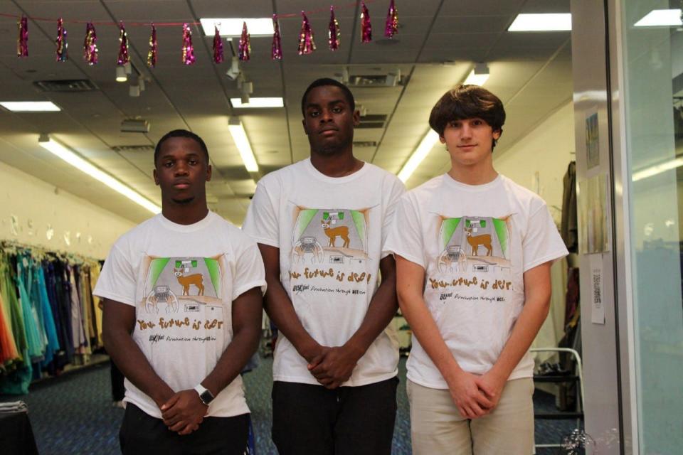 UthMpact teen members Michael Shaw, Larnell Michel and Alex Andrande, left to right, wearing UthMpact Facts T-shirts.